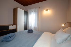 Posteľ alebo postele v izbe v ubytovaní Apartmani Nena i Branko