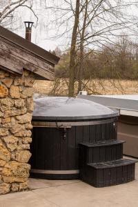 a round building with a snow covered roof at Atpūtas komplekss ''Klintis'' in Bauska