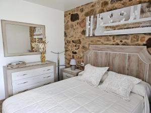 En eller flere senge i et værelse på Casa da Colorada - Costa da Morte