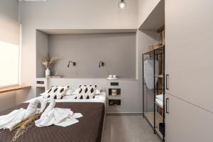 Postel nebo postele na pokoji v ubytování Luxury Memories Suites