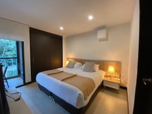 Een bed of bedden in een kamer bij Aeroluxe Hotel & Suites - Llanogrande VIP