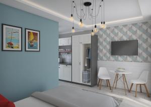 a bedroom with a bed and a table and chairs at Piroska Fogadója in Siófok