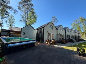 a backyard with a pool and a row of houses at Family Resort in Dziwnów