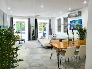 a living room with a table and a couch at CariVenta in Caye Caulker