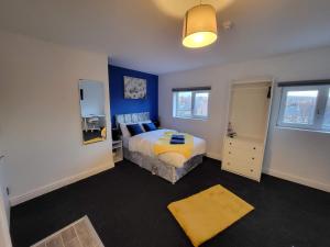 a bedroom with a bed and a tv in it at Premier Nottingham Studios - Burford Road in Nottingham