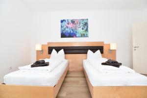 A bed or beds in a room at PM-APART Premstätten