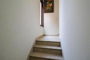 a staircase in a building with a picture on the wall at Collection O Hotel Radiant Inn in Gurgaon