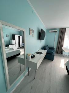 a room with a mirror and a living room at A-more accommodation in Split