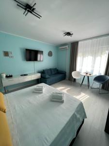 a bedroom with a bed and a living room at A-more accommodation in Split