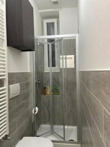 a shower with a glass door in a bathroom at Casa Vacanze Chiara in Trieste