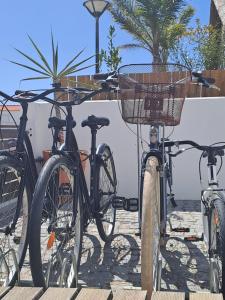 a group of bikes parked next to each other at Casa Atlântico Carvalhal Comporta, apartamento piscina aquecida in Carvalhal