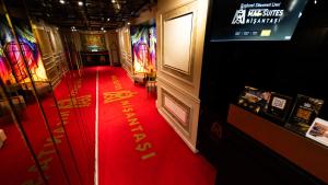 a red carpet in a room with writing on the floor at Mas Suites Nisantasi in Istanbul