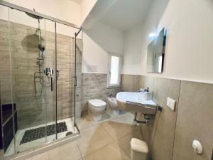 a bathroom with a shower and a toilet and a sink at L'Angolo del Saraceno in Carini +61 photos