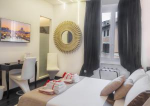 A bed or beds in a room at Navona Living Rome
