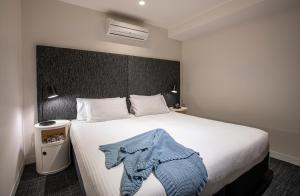 Postel nebo postele na pokoji v ubytování Corporate Living Accommodation Abbotsford