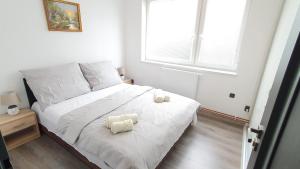 Postel nebo postele na pokoji v ubytování LilLy HOME 36