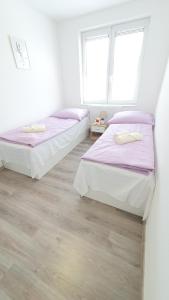Postel nebo postele na pokoji v ubytování LilLy HOME 36