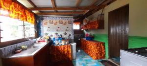 a kitchen with a sink and a counter top at AerowView Home Retreat in Matei