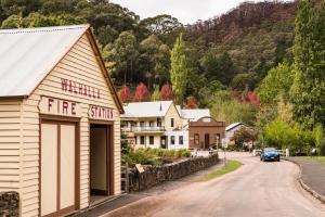 a small town with a fire station on the side of a road at Luxury winter escape with Mountain Views by Scotch Hill Truffle Farm in Neerim South