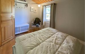 Llit o llits en una habitació de Amazing Home In Knäred