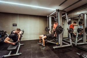 a group of men working out in a gym at SLS Buenos Aires Puerto Madero in Buenos Aires