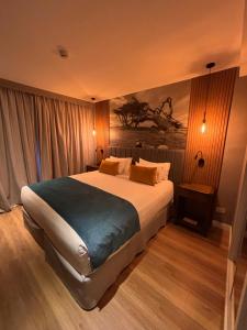 Säng eller sängar i ett rum på Alto Andino Hotel