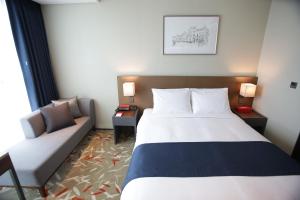 Postel nebo postele na pokoji v ubytování ASTI Hotel Busan Station