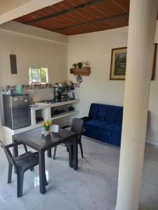 a living room with a table and a blue couch at Apartamento Dorado Sunset in Santa Marta +10 photos