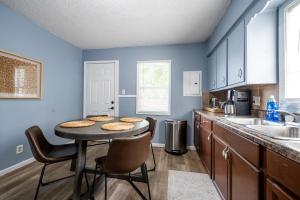 a kitchen with a table with cookies on it at Affordable, Quaint Retreat! 5 Mins to Downtown in Indianapolis