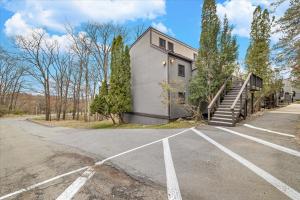 an empty parking lot in front of a building at C52-CAMELBACK waterPark,Pool,Tennis,Zipline,hottub in Tannersville