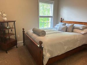 a bedroom with a large bed with a window at Grand Lux Getaway in Lexington