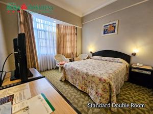 Postel nebo postele na pokoji v ubytování Hotel Rosa Passadena