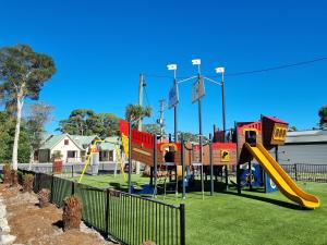 a playground with a slide in a park at BIG4 Strahan Holiday Retreat in Strahan +134 photos