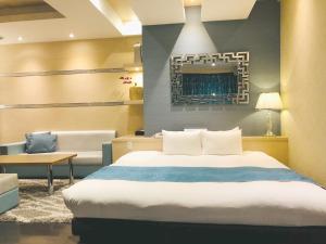 Postel nebo postele na pokoji v ubytování Hotel Square FujiGotemba