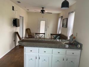 a kitchen with a large counter top in a room at Rio grand country getaway in Harlingen