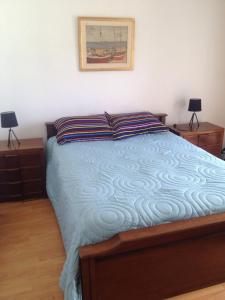 Łóżko lub łóżka w pokoju w obiekcie Apartamento En Las Delicias