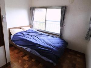 Postel nebo postele na pokoji v ubytování Shionome house