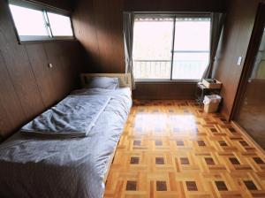 Postel nebo postele na pokoji v ubytování Shionome house