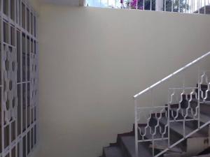 a staircase in a building with a white wall at casa de 2 pisos amplia y bonita in Oaxaca City