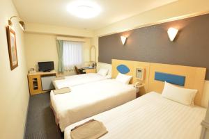 Postel nebo postele na pokoji v ubytování Hotel Marutani + 25 fotografií