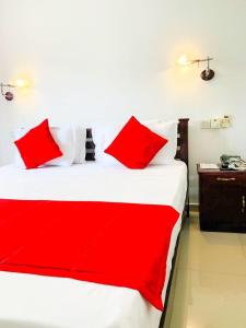 מיטה או מיטות בחדר ב-Owin Rich Godakawela