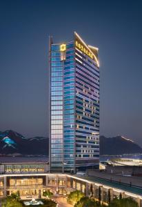 a building with a sign on the side of it at Shangri-La Wenzhou in Wenzhou