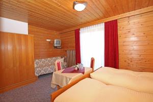 Postel nebo postele na pokoji v ubytování Pension Delacher
