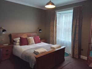 Postel nebo postele na pokoji v ubytování Lime Tree Hotel
