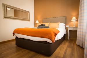 a bedroom with a bed with a teddy bear on it at Holidays2Malaga Comfort Center in Málaga