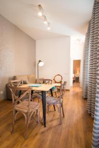 a dining room with a table and chairs at Holidays2Malaga Comfort Center in Málaga