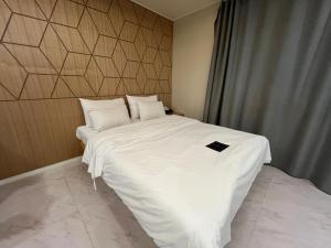 En eller flere senger på et rom på Carlton Hotel Bupyeong