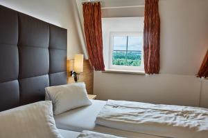 Łóżko lub łóżka w pokoju w obiekcie Landhotel Wachau - Hotel Garni