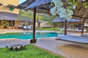a resort with two beds and a swimming pool at Pepo Villa, Anasa Hotels & Experiences in Lamu