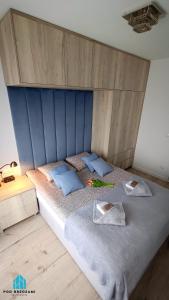 Posteľ alebo postele v izbe v ubytovaní Pod Brzozami Apartamenty Let's Sea Gąski